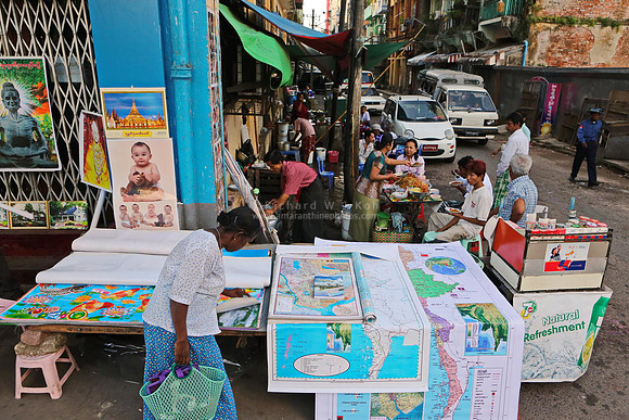 Yangon street corner stall selling maps