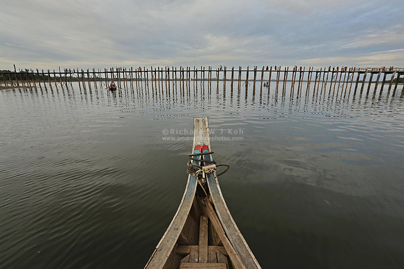 Mandalay Amarapura U Bein Bridge seen from boat bow