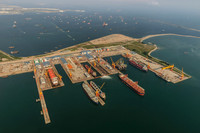 24 An aerial view of a specialized marine services shipyard with an LNG carrier and oil tankers in Tuas, Singapore. Aerial photo taken from a helicopter ARN_9373m