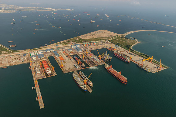 24 An aerial view of a specialized marine services shipyard with an LNG carrier and oil tankers in Tuas, Singapore. Aerial photo taken from a helicopter ARN_9373m