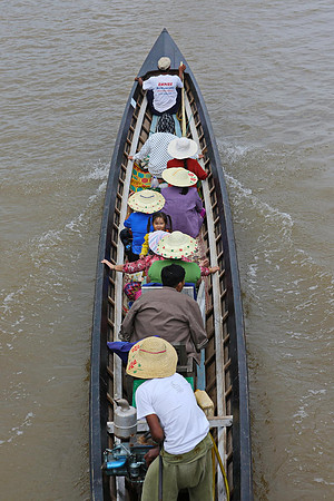 Inle Lake Nyaungshwe town longtail boat passengers girl