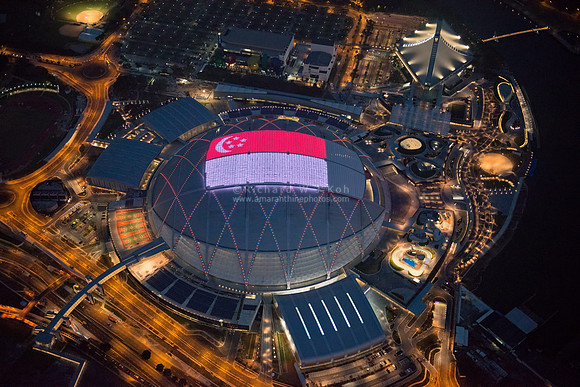 Singapore National Stadium (Sports Hub) night aerial photo with state flag LED panel display
