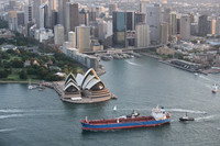 Container ship entering Sydney Harbour passing Opera House