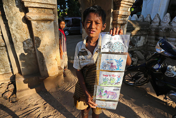 Bagan boy selling self made post cards
